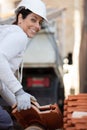 female worker with roof tiles