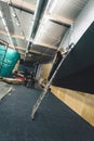 Female worker setting new briar climbing holds at the climbing gym