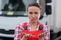 female worker showing dirty hands and making rueful facial expression Royalty Free Stock Photo