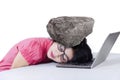 Female worker with a stone on her head Royalty Free Stock Photo
