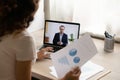 Female worker talk on video call with male CEO Royalty Free Stock Photo