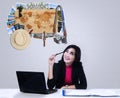 Female worker thinking famous places to vacation Royalty Free Stock Photo