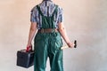 Female worker with tool kit and gavel Royalty Free Stock Photo