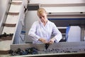 Woman sorting grape for wine at transporter.