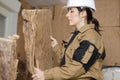 Female worker working with insulation boards