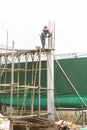 Female worker working on top of construction site, labor day concept Royalty Free Stock Photo