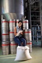 Female worker writing on clipboard in factory Royalty Free Stock Photo