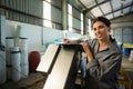 Female worker writing on clipboard in olive factory Royalty Free Stock Photo