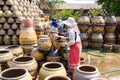 Female workers washing Dragon flower pots.