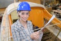 Female working at boat workshop Royalty Free Stock Photo