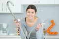 female working on sink using wrench Royalty Free Stock Photo