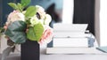 Female workspace with flowers bouquet on white background. Womens office desk