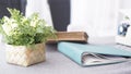 Female workspace with flowers bouquet on white background. Womens office desk