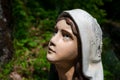 Female worshipper and prayer is looking up the God or Virgin Mary Royalty Free Stock Photo