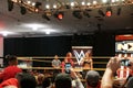 Female wrestler Becky Lynch talks on mic with NXT star Sasha Banks also in ring