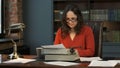 Female Writer Using Vintage Typewriter for Work Royalty Free Stock Photo