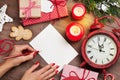 Female writing christmas greeting card Royalty Free Stock Photo