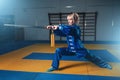 Female wushu fighter with sword in action