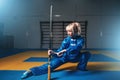 Female wushu fighter with sword in action