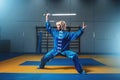 Female wushu fighter with sword in action