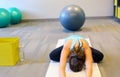 Female yoga excersise on a white mat