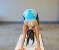 Female yoga excersise on a white mat Royalty Free Stock Photo