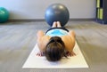Female yoga excersise on a white mat Royalty Free Stock Photo