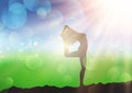 Female in yoga pose against sunny defocussed landscape Royalty Free Stock Photo