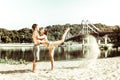 Female yogi leaning on her partner while stretching