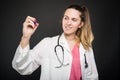 Female young doctor writing on invisible board Royalty Free Stock Photo