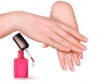 Female young hands with a pink nail polish bottle.