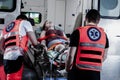 Young victim of the accident lies on a stretcher in an ambulance