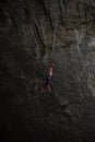 Female on a zipline in the Prohodna cave in Bulgaria