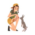 Female Zoo Worker Feeding Rabbit with Fresh Carrot, Veterinarian or Professional Zookeeper Character Caring of Wild