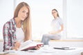 Females reading in office Royalty Free Stock Photo