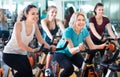 Females training on exercise bikes Royalty Free Stock Photo