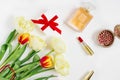 Femenine is a composition of women`s work space with gifts for Mother`s Day and Valentine`s Day. Cosmetics and a bouquet of tul Royalty Free Stock Photo