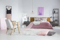 Feminine bedroom with woolen blanket Royalty Free Stock Photo