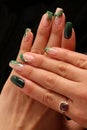 Feminine decorated nails with green colors