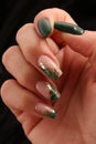 Feminine decorated nails with green colors