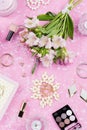 Feminine flat lay with woman fashion accessories, lingerie, jewelry, cosmetics, coffee and flowers. Top view Royalty Free Stock Photo