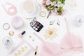 Feminine flat lay with woman fashion accessories, lingerie, jewelry, cosmetics, coffee and flowers. Top view Royalty Free Stock Photo