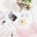 Feminine flat lay with women fashion accessories, lingerie, jewelry, cosmetics, coffee and flowers. Top view Royalty Free Stock Photo