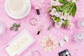 Feminine flat lay with women fashion accessories, lingerie, jewelry, cosmetics, coffee and flowers. Top view Royalty Free Stock Photo