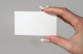 Feminine Hand Holding Business Card