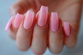 Feminine Hand with Pink Nails and Glitters, Ideal for Beauty and Fashion Themes