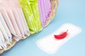Feminine hygiene products, menstrual sanitary pads in the basket. First menstruation. Personal care, woman hygiene conception. Sof