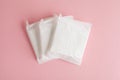 Feminine hygiene and protection, sanitary pads on pastel pink background, top view, flat layout Royalty Free Stock Photo