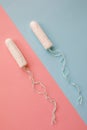 Feminine hygiene tampon on a pink background. The concept of feminine hygiene during menstruation. Flat lay, top view