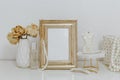 Feminine Mockup vintage gold frame and candle. Wedding still life. Royalty Free Stock Photo